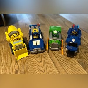 Four Paw Patrol vehicles with their pups